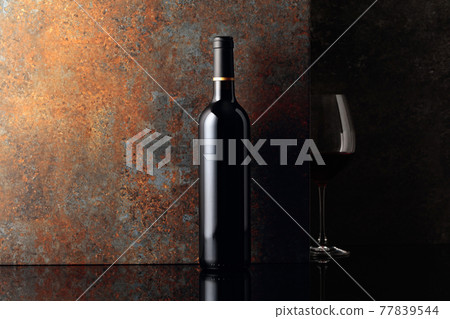 Red wine on rusty brown background. Red wine on rusty brown background. 77839544