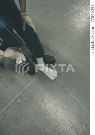 Factory worker in toe socks 77840398