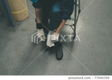 Factory worker in toe socks 77840399