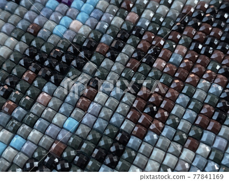 Close-up, colorful texture square diamond embroidery bright. Hobbies and entertainment. Diy concept. Close-up, colorful texture square diamond embroidery bright. Hobbies and entertainment. Diy concept. 77841169