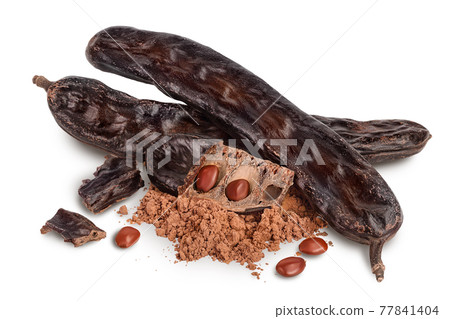 Carob pod and powder isolated on white background with clipping path and full depth of field. Carob pod and powder isolated on white background with clipping path and full depth of field. 77841404