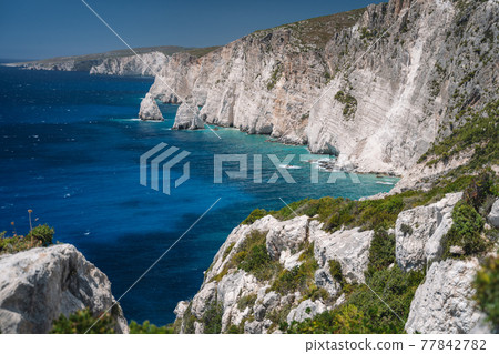 Rocky coastline of Zakynthos Island near Plakaki beach, Agalas. Ionian Sea and limestone cliffs , Greece 77842782