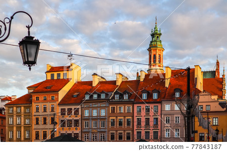 Historical buildings at Market Square of the Old Town with Christmas decorations in sunset. Warsaw, Poland Historical buildings at Market Square of the Old Town with Christmas decorations in sunset. Warsaw, Poland 77843187