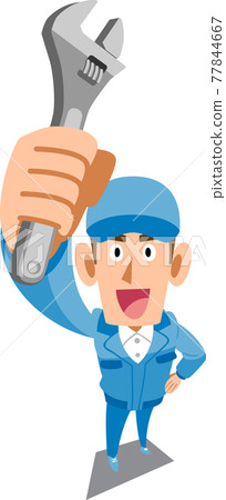 A man in blue work clothes holding a spanner 77844667