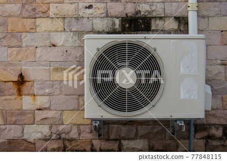 air compressor on the brick wall air compressor on the brick wall 77848115