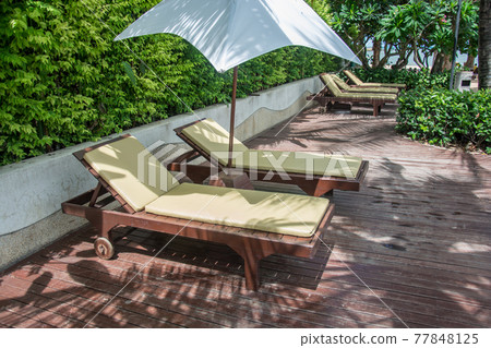 Chairs on a pool deck Chairs on a pool deck 77848125