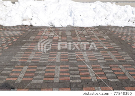 Parking lot in a snowy country where snow was removed 77848390