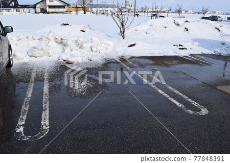 Parking lot in a snowy country where snow was removed Parking lot in a snowy country where snow was removed 77848391
