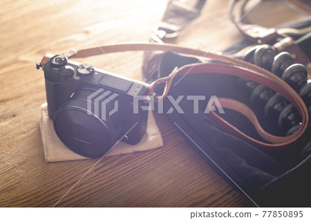 mirrorless camera with leather strap 77850895