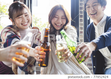 Young people having a home party Young people having a home party 77852424