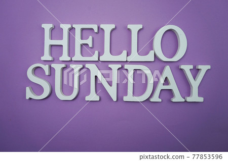 Hello Sunday wooden letter alphabet on purple background 77853596