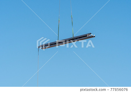 Construction site crane suspended load 77856076