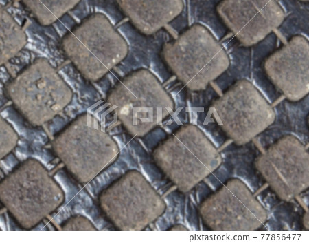blurred Detail of the pattern from a manhole cover blurred Detail of the pattern from a manhole cover 77856477