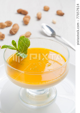 delicious Pana cotta dessert with mango and peanuts delicious Pana cotta dessert with mango and peanuts 77857614