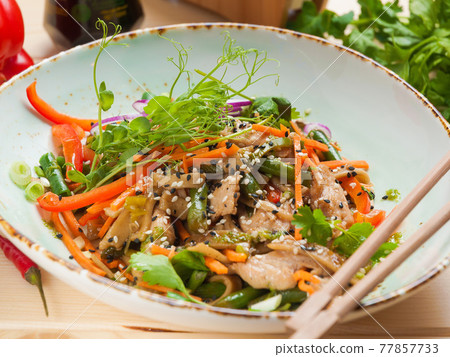 wheat noodles with pork and vegetables. Asian cuisine wheat noodles with pork and vegetables. Asian cuisine 77857733