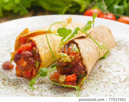 traditional Mexican cuisine tacos with chicken beef pork and vegetables traditional Mexican cuisine tacos with chicken beef pork and vegetables 77857891