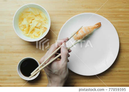Japanese kitchen. Set of Japanese sushi and rolls. Food sticks. 77859395