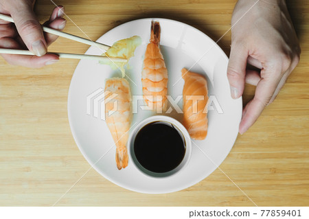 Japanese kitchen. Set of Japanese sushi and rolls. Food sticks. Japanese kitchen. Set of Japanese sushi and rolls. Food sticks. 77859401