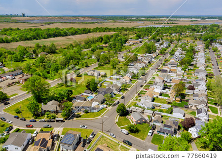 Aerial wide panorama view at the roofs of houses in the Sayreville small town of America New Jersey 77860419
