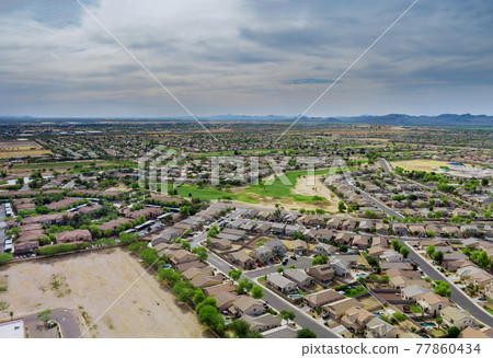 Aerial view in the sleeping area with the road over Avondale small town in AZ USA Aerial view in the sleeping area with the road over Avondale small town in AZ USA 77860434