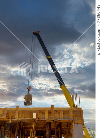 Heavy construction machinery with cement concrete bucket Heavy construction machinery with cement concrete bucket 77860445