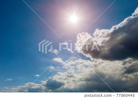 Panoramic view of blue sky with clouds and sun Panoramic view of blue sky with clouds and sun 77860448