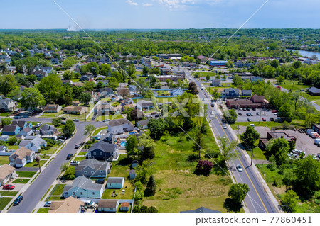 Panoramic view of view at height roofs small town of house of residential quarters Sayreville town NJ US Panoramic view of view at height roofs small town of house of residential quarters Sayreville town NJ US 77860451