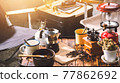 Cup Of Coffee, beans roating and Ingredients for making coffee  and accessories on the table wooden background. Coffee making concept 77862692