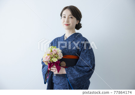 A female kimono wearing an indigo komon A female kimono wearing an indigo komon 77864174