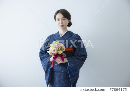 A female kimono wearing an indigo komon A female kimono wearing an indigo komon 77864175