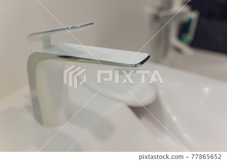 Bathroom interior with white sink and faucet. Bathroom interior with white sink and faucet. 77865652