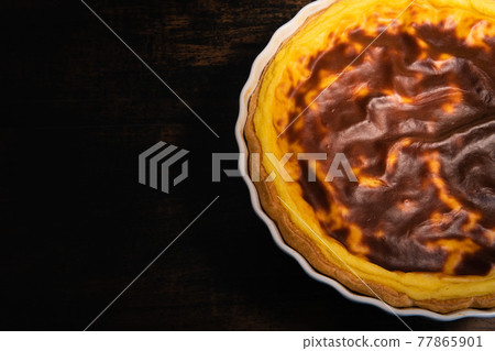 Parisian Flan, cutted classic tart served on a plate copy space 77865901