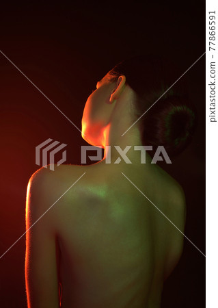 Female back in color light. Beautiful Woman in Colorful bright lights 77866591