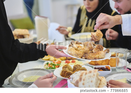 Muslim family having iftar together during Ramadan 77866885
