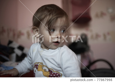 cute little one year old baby and making first steps 77867998