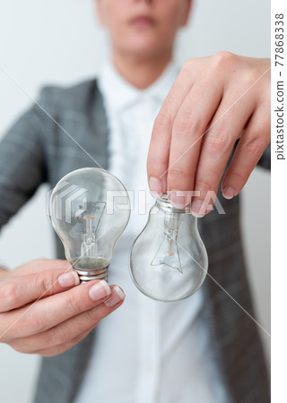 Lady Holding Two Lamps Upside Down With Outfit Proposing New Ideas For Project, Business Woman Carry 2 Bulbs Opposite Displaying New Technologies, Two Vise Versa Lamps Exhibiting Fresh Idea