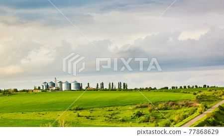 The Agricultural silos on sunset after thunderstorm 77868629