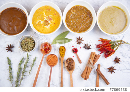 Various kinds of spices and curries Various kinds of spices and curries 77869588