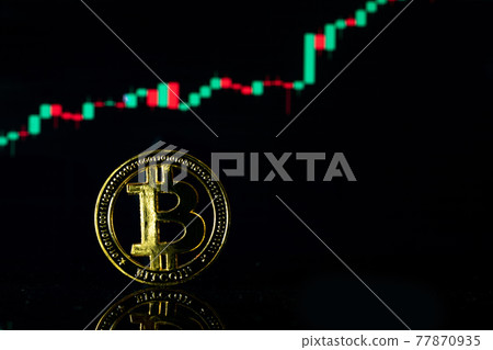 Bitcoin stock. Gold Crypto currency BTC Bitcoin on graph chart background. Golden Bit Coin virtual cryptocurrency or blockchain technology. Virtual money and mining concept. 77870935