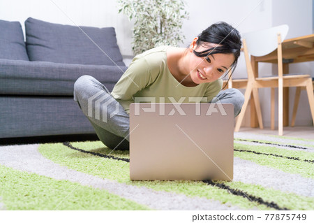 Women doing online fitness Women doing online fitness 77875749