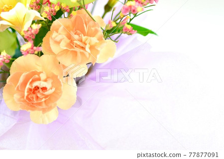 Flower arrangement with orange carnation Flower arrangement with orange carnation 77877091