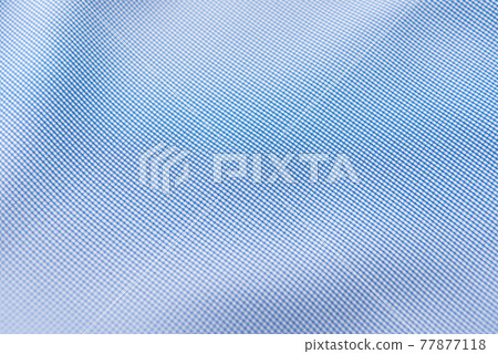 Closeup of rippled blue silk fabric, blue fabric texture background, 77877118