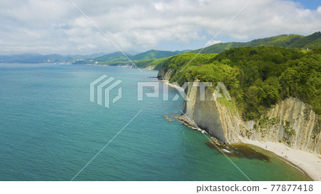 Drone view of rocks, nature, sea and water - Skala Kiseleva is a natural monument on the territory of the Tuapse district of the Krasnodar Territory. Aerial view from above. 4K footage. Drone view of rocks, nature, sea and water - Skala Kiseleva is a natural monument on the territory of the Tuapse district of the Krasnodar Territory. Aerial view from above. 4K footage. 77877418