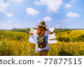 Asian women travel Rice fields green On the mountains in the holiday. happy and enjoying a beautiful nature. 77877515