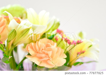 Beautiful flower arrangement with orange carnations 77877825