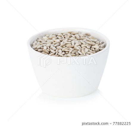 Sunflower seeds isolated on white background. Sunflower seeds isolated on white background. 77882225
