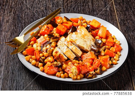 Salad of chickpea, butternut on a plate, top view Salad of chickpea, butternut on a plate, top view 77885638