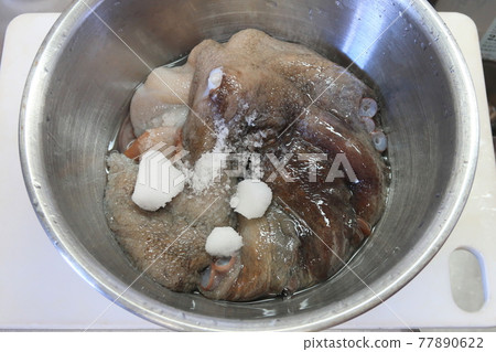 Raw octopus preparation 77890622
