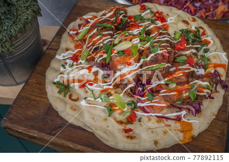 Traditional pizza Delicious on wooden background. Traditional pizza Delicious on wooden background. 77892115