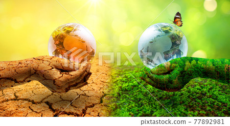 Two orb hands with very different environments Earth Day or World Environment Day Global Warming and Pollution Two orb hands with very different environments Earth Day or World Environment Day Global Warming and Pollution 77892981